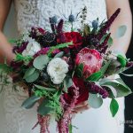 Deep red tones in bridal bouquet