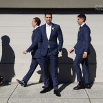 Groom with walking groomsmen
